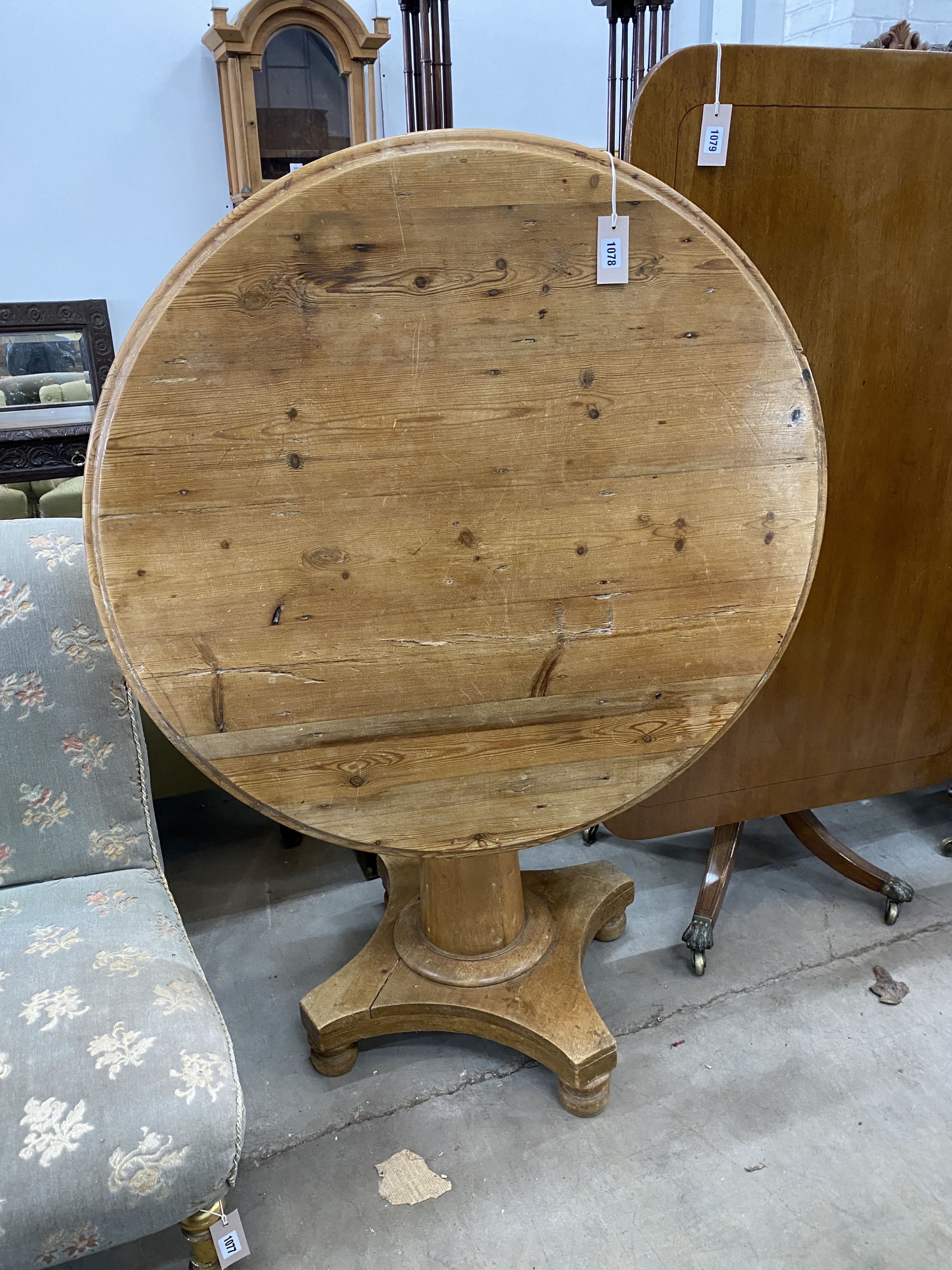 A Victorian circular pine tilt top breakfast table, diameter 92cm, height 73cm